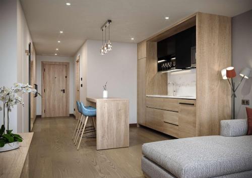 a room with a bed and a kitchen with a counter at Hyatt House Nairobi Westlands in Nairobi