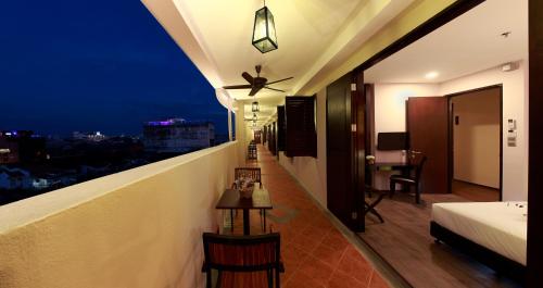 Ένα ή περισσότερα κρεβάτια σε δωμάτιο στο Kimberley Hotel Georgetown