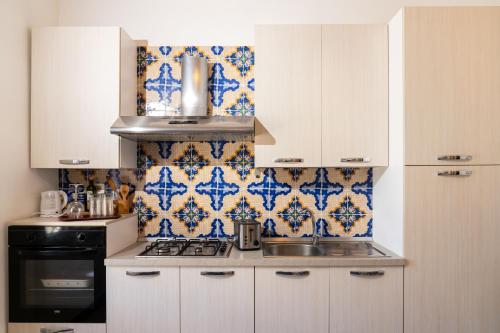Η κουζίνα ή μικρή κουζίνα στο Ai quattro canti di città, appartamento in centro