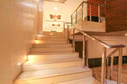 a set of stairs with lights on them at FabHotel Maruthi Residency - Nr Lakdikapul Metro Station in Hyderabad