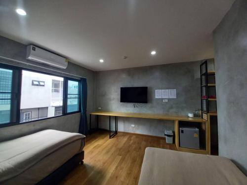 Llit o llits en una habitació de MA PEAK hotel
