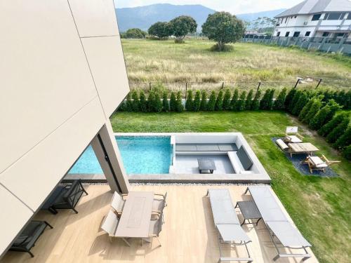 a view of a swimming pool from a building at แคนเทอเบอรี่ เขาใหญ่ พูลวิลล่า สระน้ำอุ่น CANTERBURY Khaoyai in Ban Rai Khlong Sai