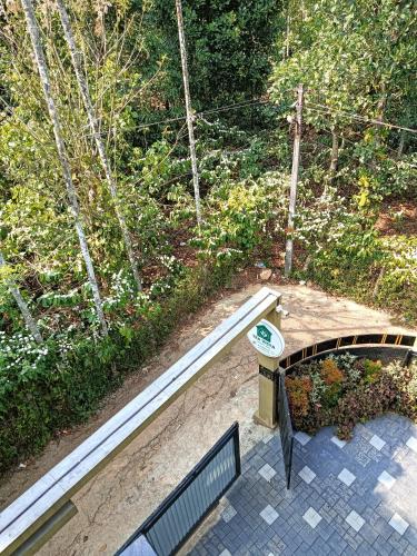 an overhead view of a bridge and a bench at Tea vista holiday home in Kalpetta