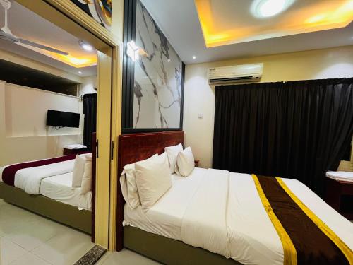 Katil atau katil-katil dalam bilik di Al Nakheel Hotel Apartments