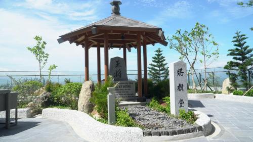 a gazebo with chinese writing on it at Da Nang - Mikazuki Japanese Resorts & Spa in Da Nang