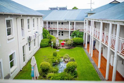 an aerial view of a garden between two buildings at Vetho 2 Apartments OR Tambo Airport in Kempton Park