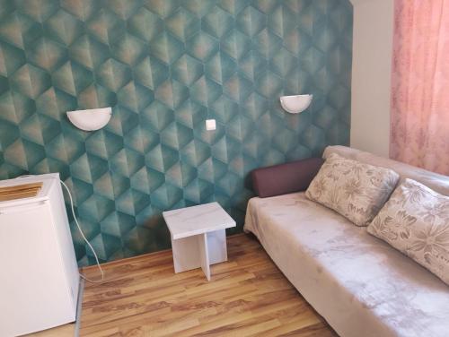 a living room with a couch and a table at Studio in Sea Breeze Complex Sveti Vlas in Sveti Vlas