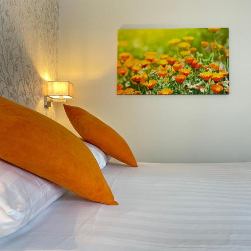 Ένα ή περισσότερα κρεβάτια σε δωμάτιο στο Fletcher Hotel-Restaurant Oud London