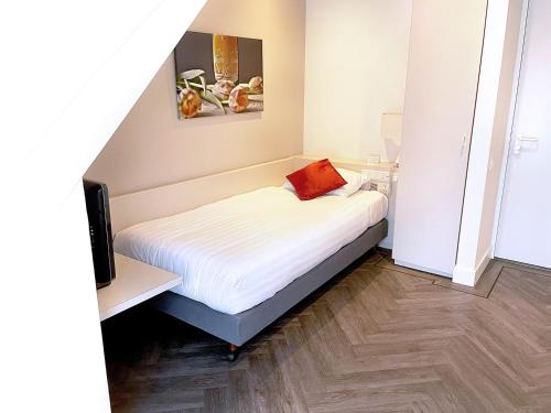 Ένα ή περισσότερα κρεβάτια σε δωμάτιο στο Fletcher Hotel-Restaurant Oud London