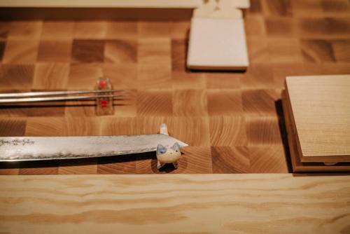 a knife sitting on top of a wooden floor at The Burman Hotel in Tallinn