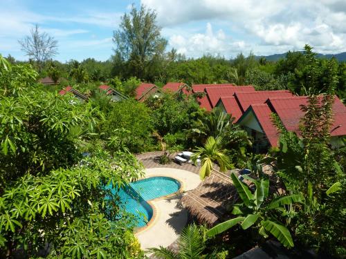 an aerial view of a resort with a swimming pool at Ladda Resort in Khao Lak