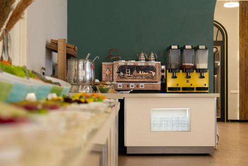 a kitchen with a counter with a counter top with a stove at Nafta Sanatorium in Naftalan