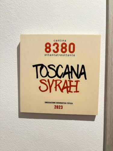 a sign on a wall that says toscana symbol at 8380 La Cantina di Piero&Netta in Montemerano