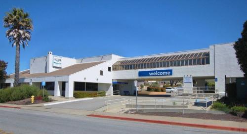 a white building with a sign that reads welcome at Motel 6 San Simeon, CA - Hearst Castle Area in San Simeon