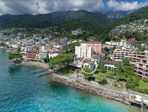 an aerial view of a city next to the water at Casa Felice by Fewotessin in Brissago