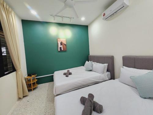 a room with two beds with teddy bears on them at NEW! Petaling Jaya Corner Landed, Kids Playground Slides, SS17,15 Pax,Seventeen Mall, Eastin, Phileo, SS2, Jaya One,UM in Petaling Jaya