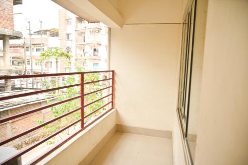 a balcony with a view of a city at Hotel Royal Beltola in Guwahati