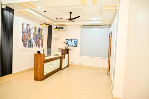 a hallway of a room with a white wall at Hotel Royal Beltola in Guwahati