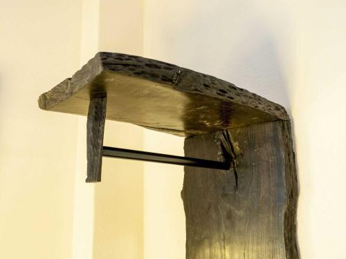 a wooden birdhouse hanging on a wall at Ferienwohnung SchlossGarten in Torgau