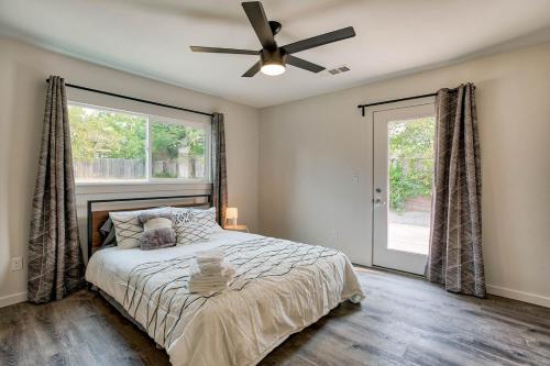 a bedroom with a bed and a ceiling fan at Starlight Retreat in Redding