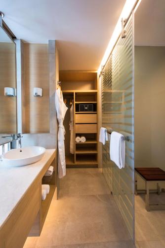 a bathroom with a sink and a shower at Hyatt Regency Lucknow Gomti Nagar in Lucknow