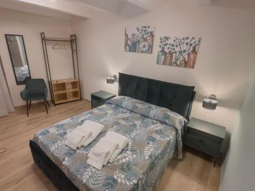 a bedroom with a bed with two pillows on it at B&B Olea Tarsia in Tarsia