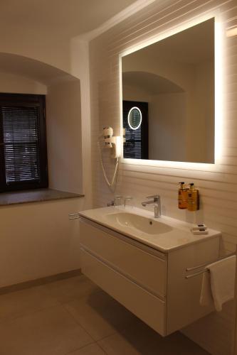 a bathroom with a sink and a mirror at Zámek Třešť in Třešť