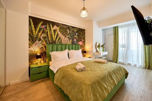 a bedroom with a large bed with a large painting on the wall at Tropicana - Infinity Pool & Spa Resort in Mamaia Nord