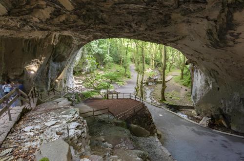 a stone archway over a road with a bench under it at Vivienda Rural Perotxenea Landetxea in Doneztebe