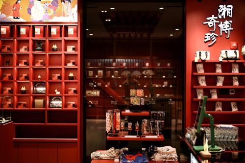 a store with red walls and a display case at Grand Hyatt Changsha-Close to Helong Sports Center in Changsha