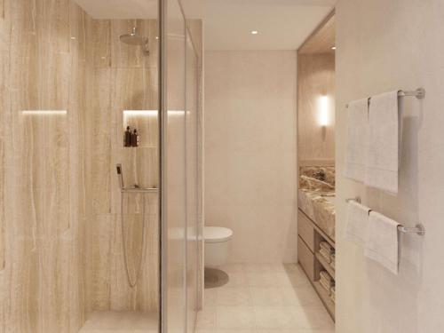 a bathroom with a shower and a toilet at Hotel Preko Ugljan Island, Curio Collection By Hilton in Preko