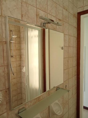 a bathroom with a mirror and a sink at Locanda dei pescatori in Domaso