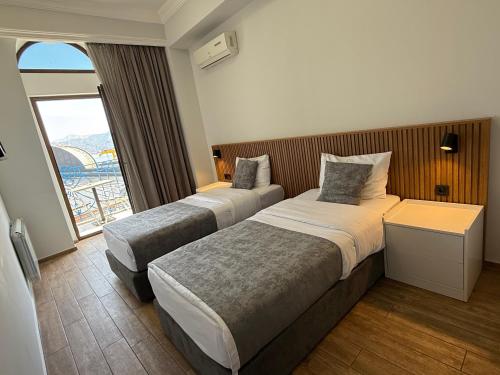 Postel nebo postele na pokoji v ubytování Hotel Old Town