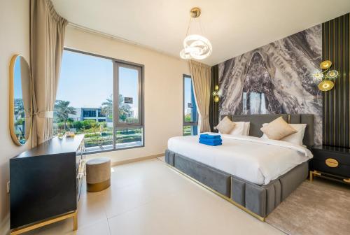a bedroom with a large bed and a large window at NewArabian Dubai HillsMaple Villa in Dubai