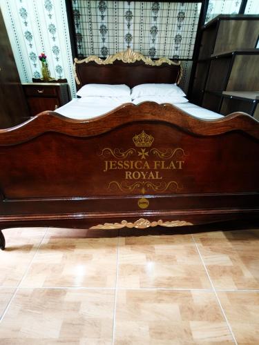 a wooden bed in a room with a wooden floor at Jessica Flat Malta Royal Guesthouse in Cospicua