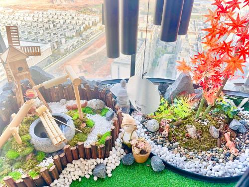 a model of a garden in a window at Tung Blossom House in Kunming