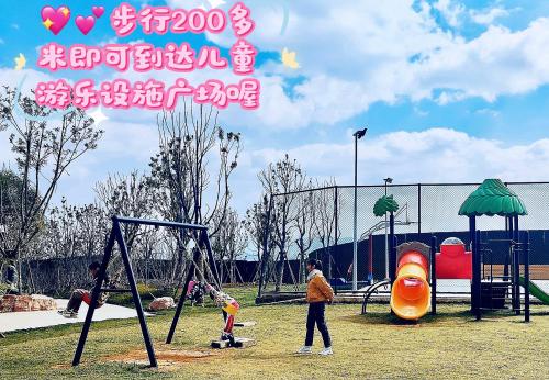 a group of children playing in a playground at Tung Blossom House in Kunming