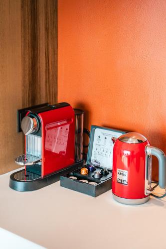 a kitchen counter with a toaster and a tea kettle at Grand Hyatt Changsha-Close to Helong Sports Center in Changsha