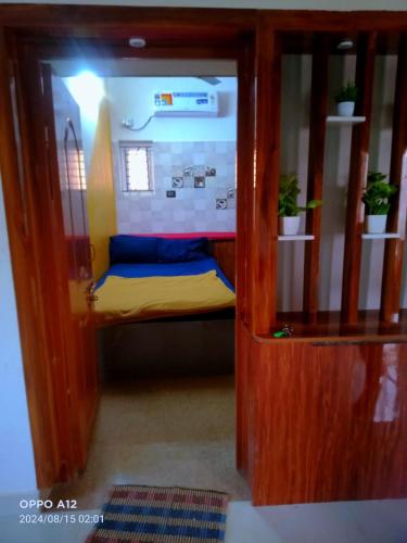 a small room with a bunk bed in it at ASSHAPPYSTAYINN HOTEL in Tiruchchirāppalli