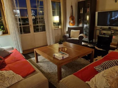 a living room with a couch and a coffee table at Haby House in Skene
