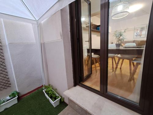 a view of a dining room and kitchen from the inside of a house at Apartamento San Andrés in Teruel
