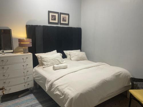 Ένα ή περισσότερα κρεβάτια σε δωμάτιο στο Cozy Apartment