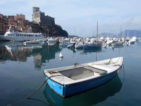 a boat is docked in a harbor with other boats at Affittacamere La Baia Di Lerici in Lerici