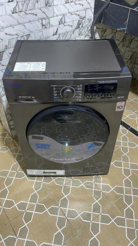 a dvd player sitting on top of a tv at Marongs Appartment in Djalabango