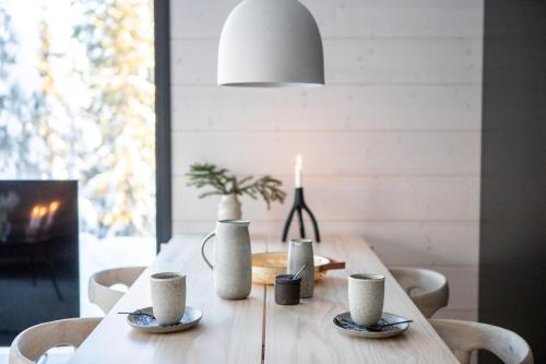 a dining room table with a candle on it at Villa Alaska in Syöte