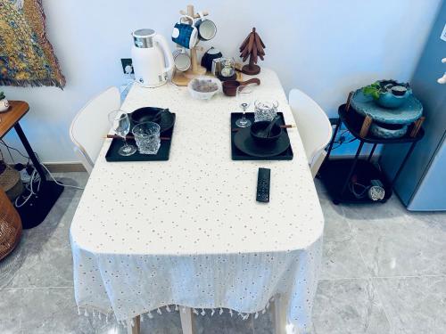 a table with a white table cloth on it at Tung Blossom House in Kunming