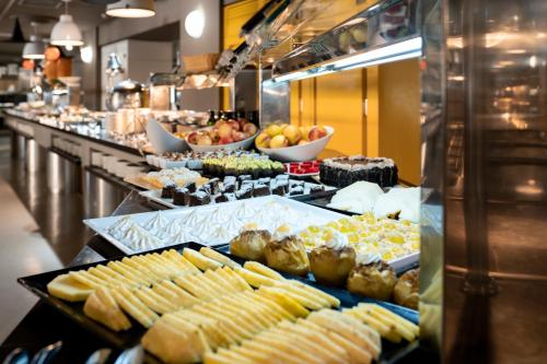 a buffet line with many different types of food at Hotel Magic Sports 4 in Oropesa del Mar