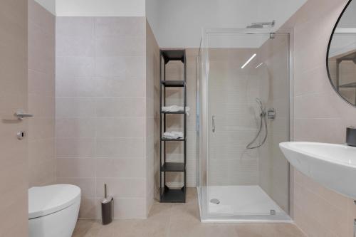a bathroom with a shower and a toilet and a sink at Cefalonia Garden with Terrace & Garage by NDP rent in Milan