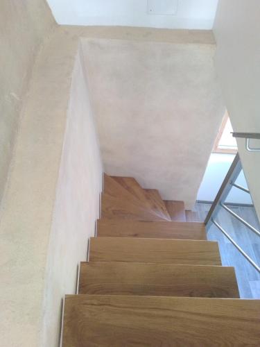 a staircase in a house with wooden floors at l 'appel du Canigou in Casteil