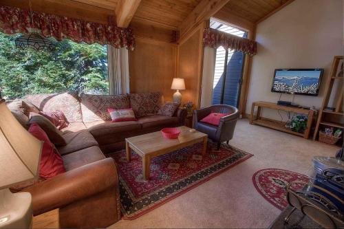 a living room with a couch and a table at Chimney Rock Condo condo in Stateline